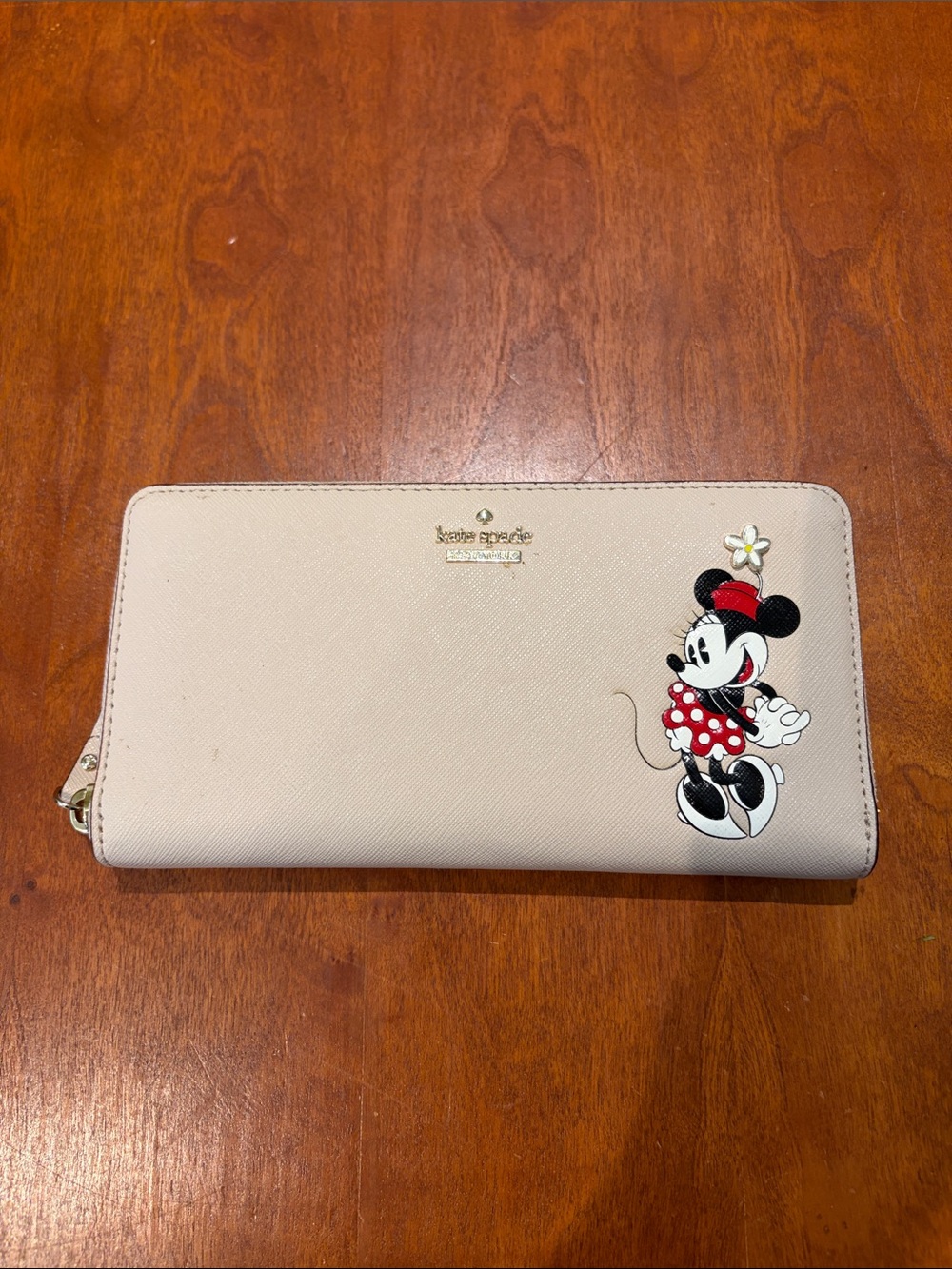 kate spade beige zip-around wallet with Minnie Mouse graphic